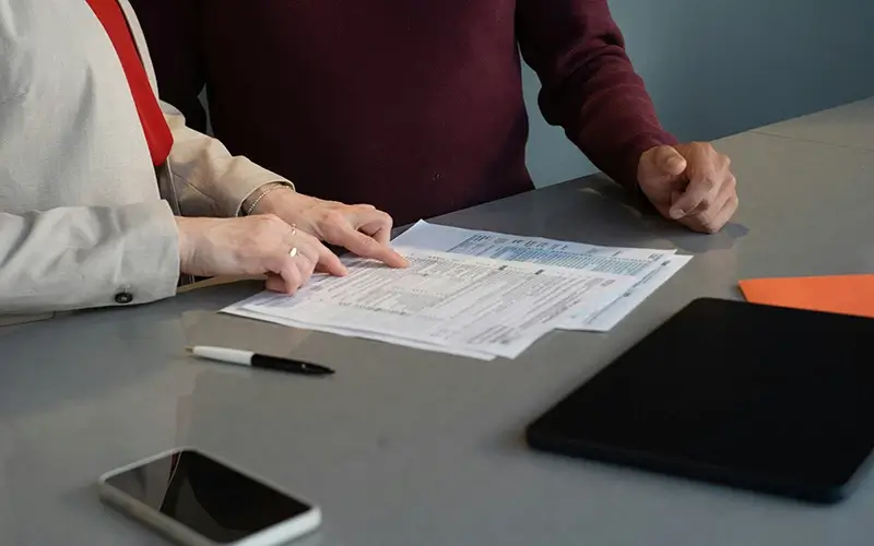 People reviewing paperwork
