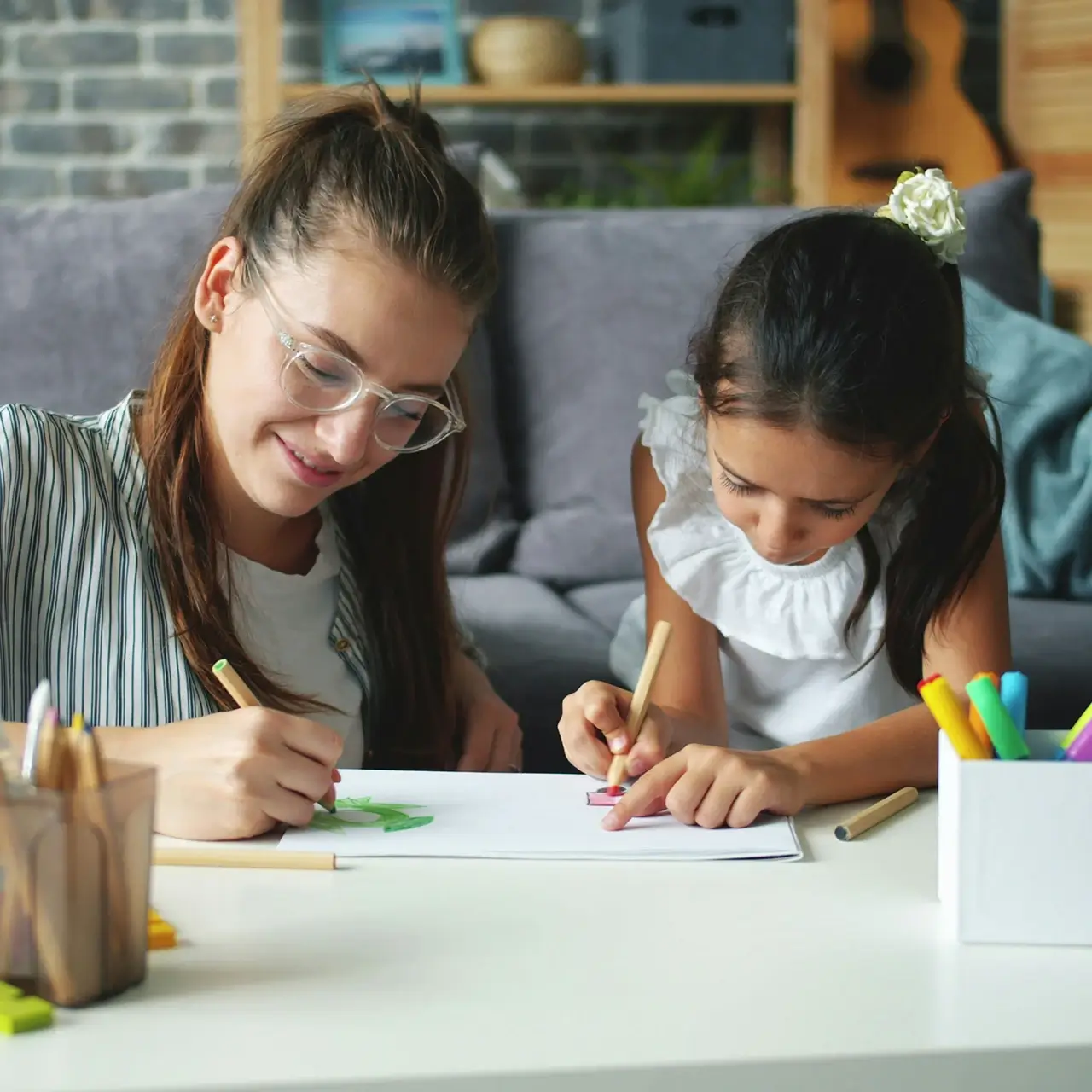 Woman and girl coloring