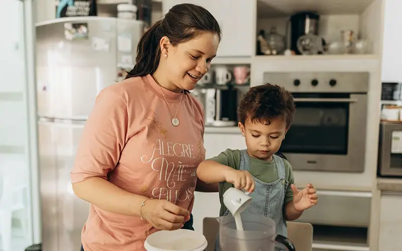 Mother and son cooking together