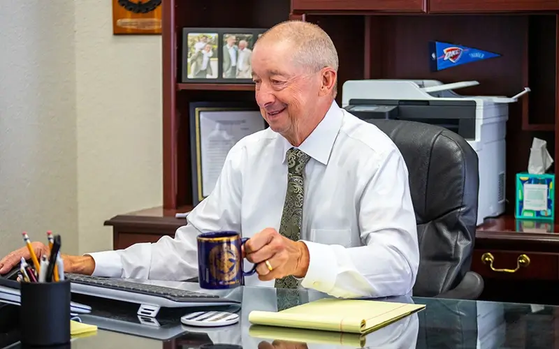 James Crook working in office
