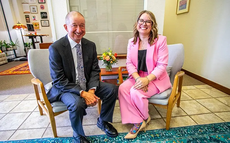 Crook Hudiburg Rooted in Family James and Casey smiling in office