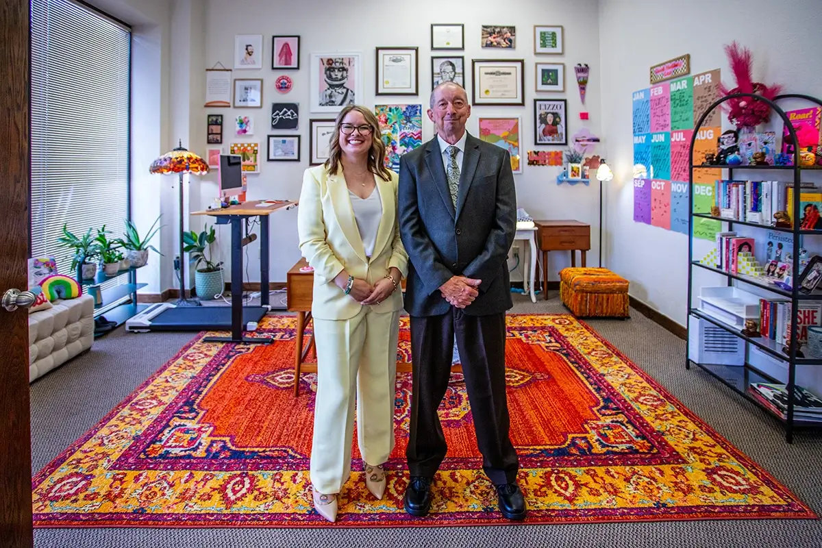 Casey Crook Hudiburg and James Crook standing in office